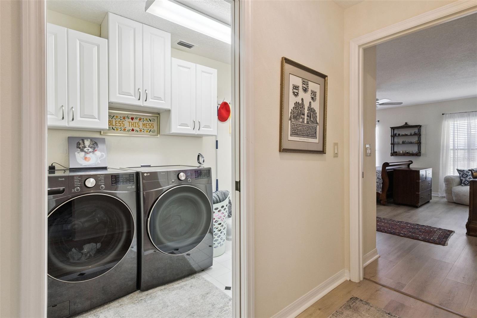 SPACIOUS LAUNDRY ROOM IS NEXT TO PRIMARY SUITE.  Washer & Dryer do NOT convey.