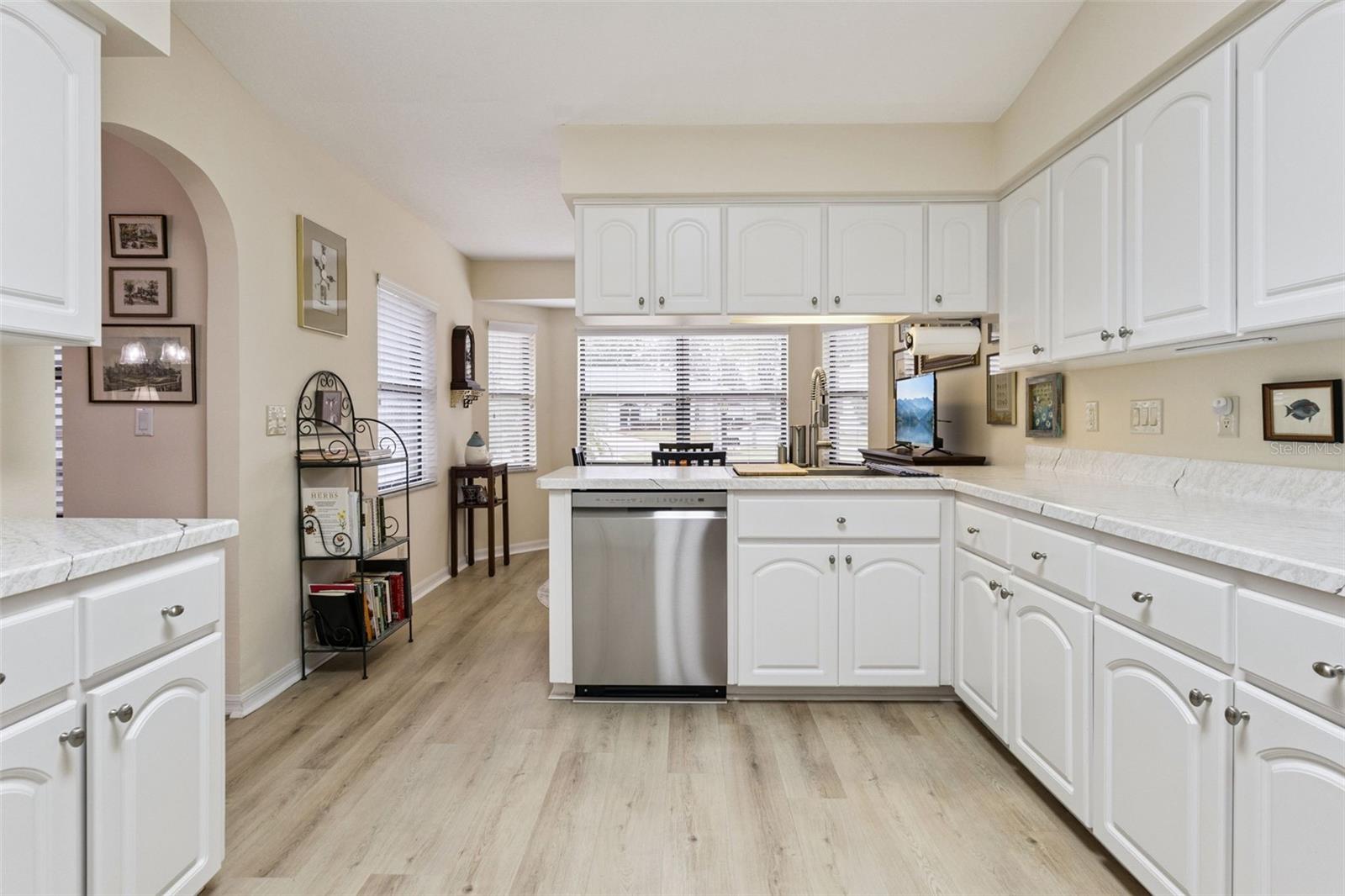 The KITCHEN has AMPLE COUNTER SPACE & CABINETS