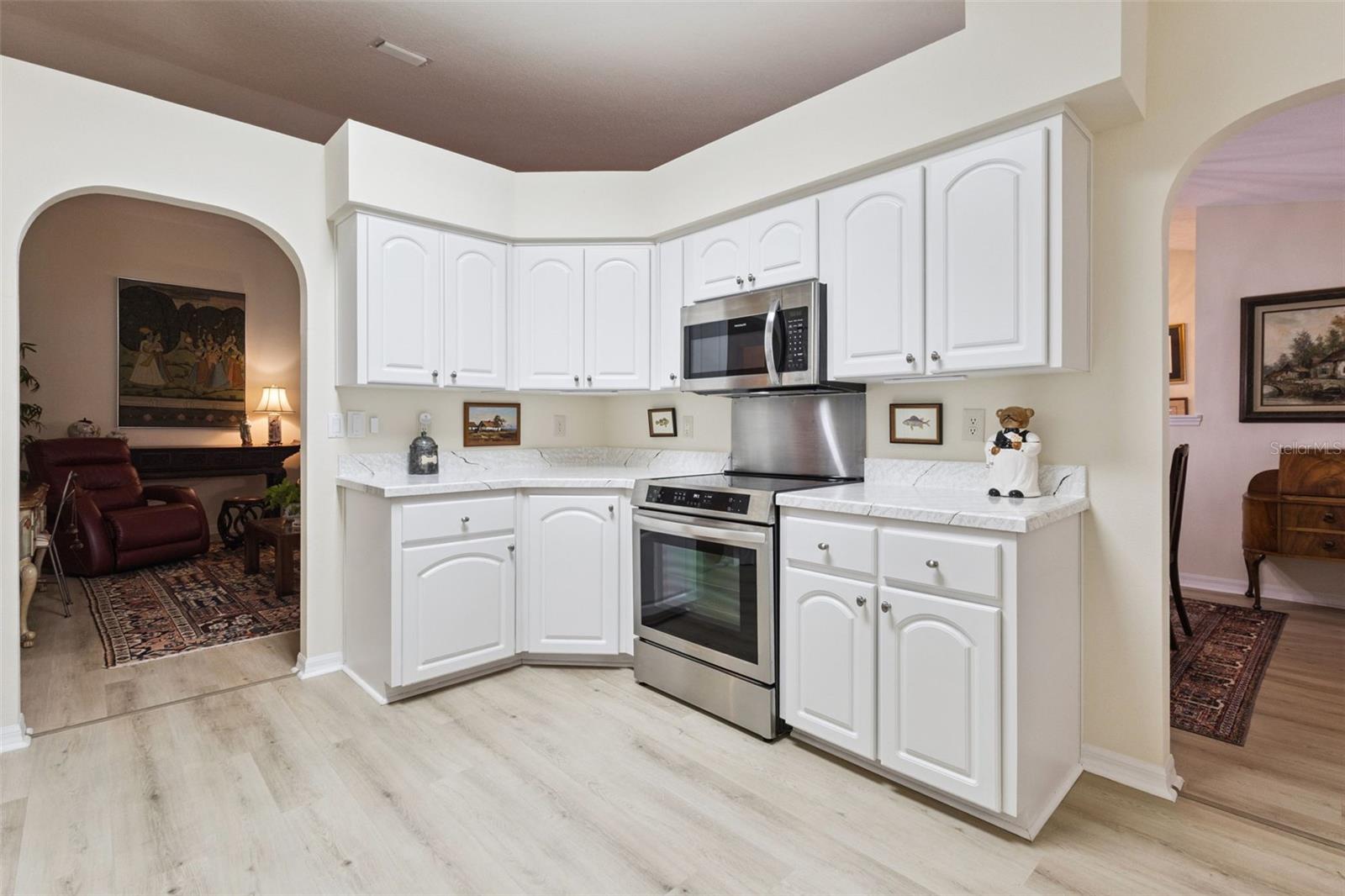 KITCHEN OPENS TO LIVING ROOM & DINING AREA
