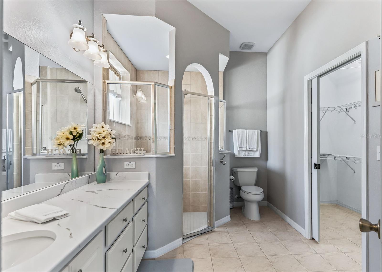 Primary ensuite with two walk in closets.