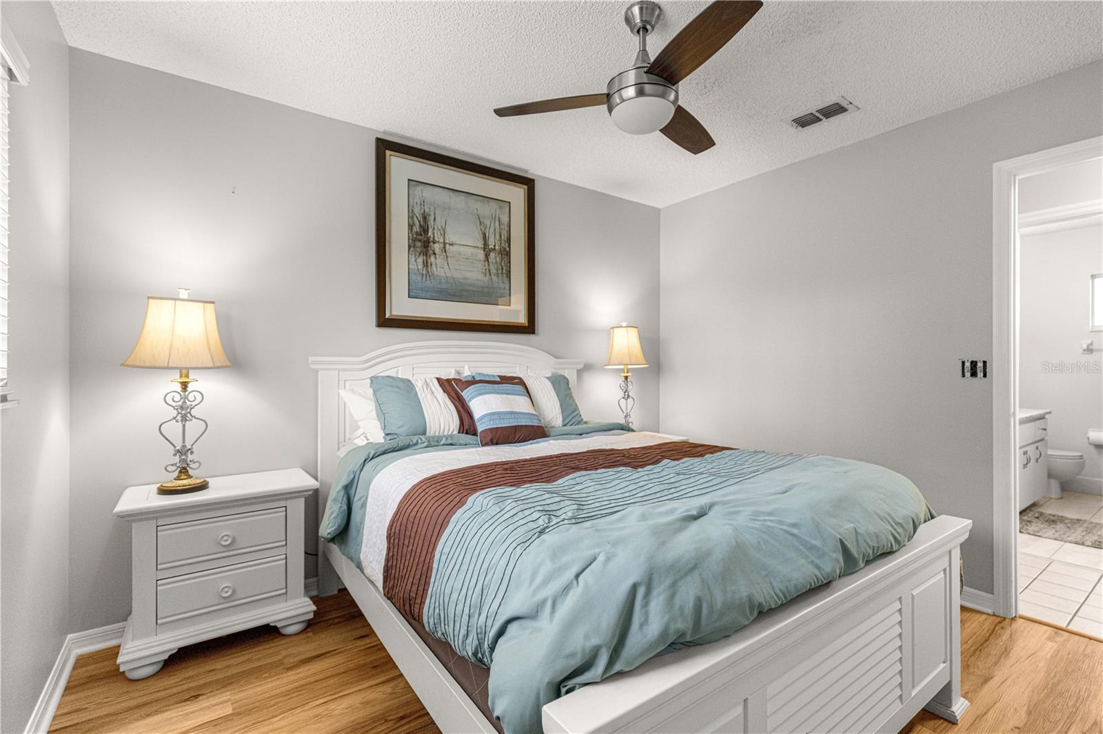 GUEST BEDROOM WITH GUEST BATHROOM RIGHT ACCROSS FROM IT