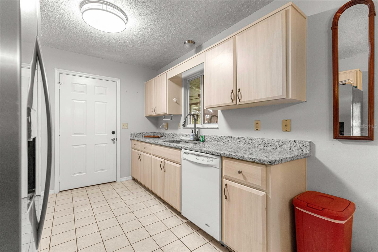 KITCHEN GRANITE COUNTERTOPS AND TILE FLOORING