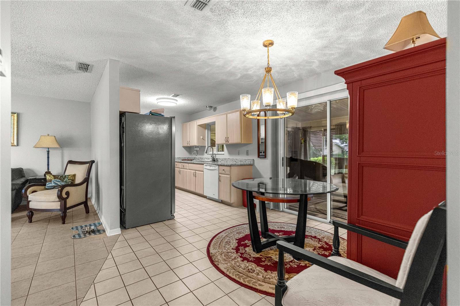 LIVING ROOM TO DINING , KITCHEN AND FLORIDA ROOM SLIDING DOORS
