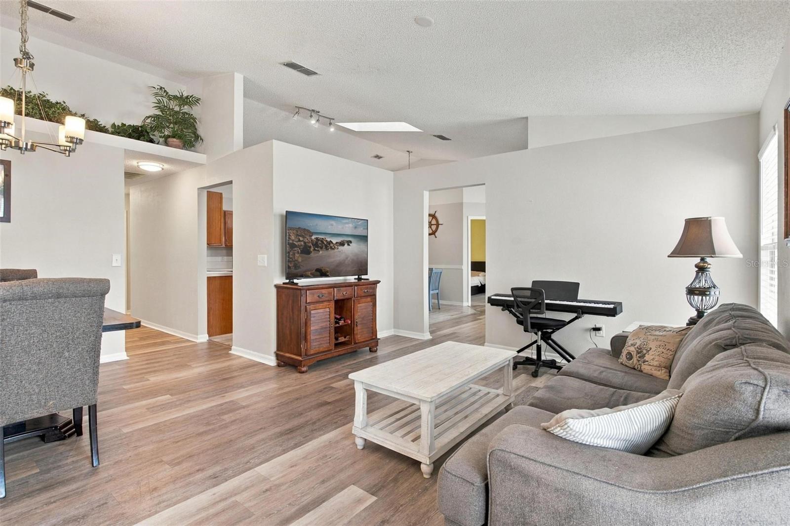 Living/Dining Area with Wood Vinyl Flooring