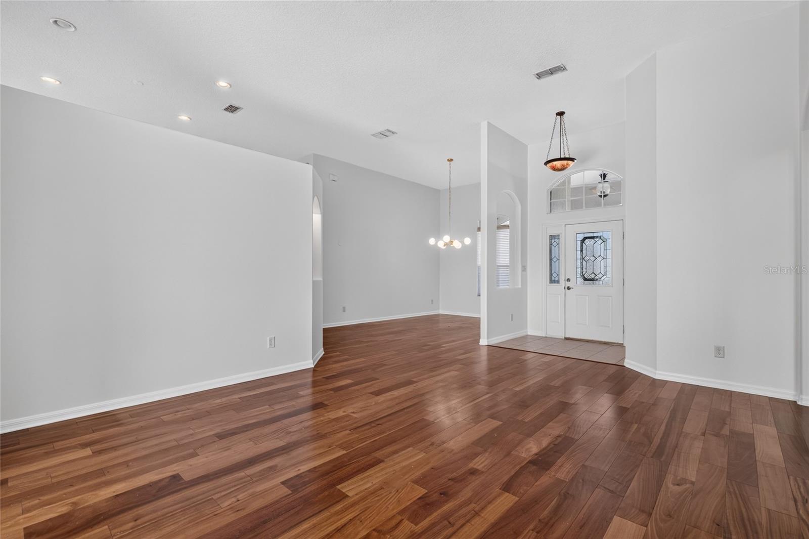 VIEW FROM THE LIVING ROOM SHOWING THE DINING ROOM AND ENTRY WAY