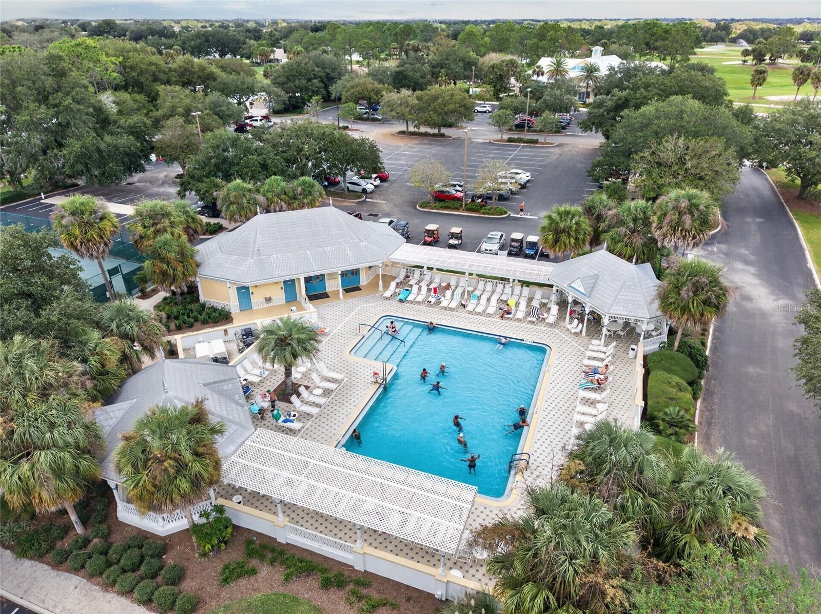 EL SANTIAGO FAMILY POOL - Aerial view of the recreation pool, deck and shaded seating beneath palms.