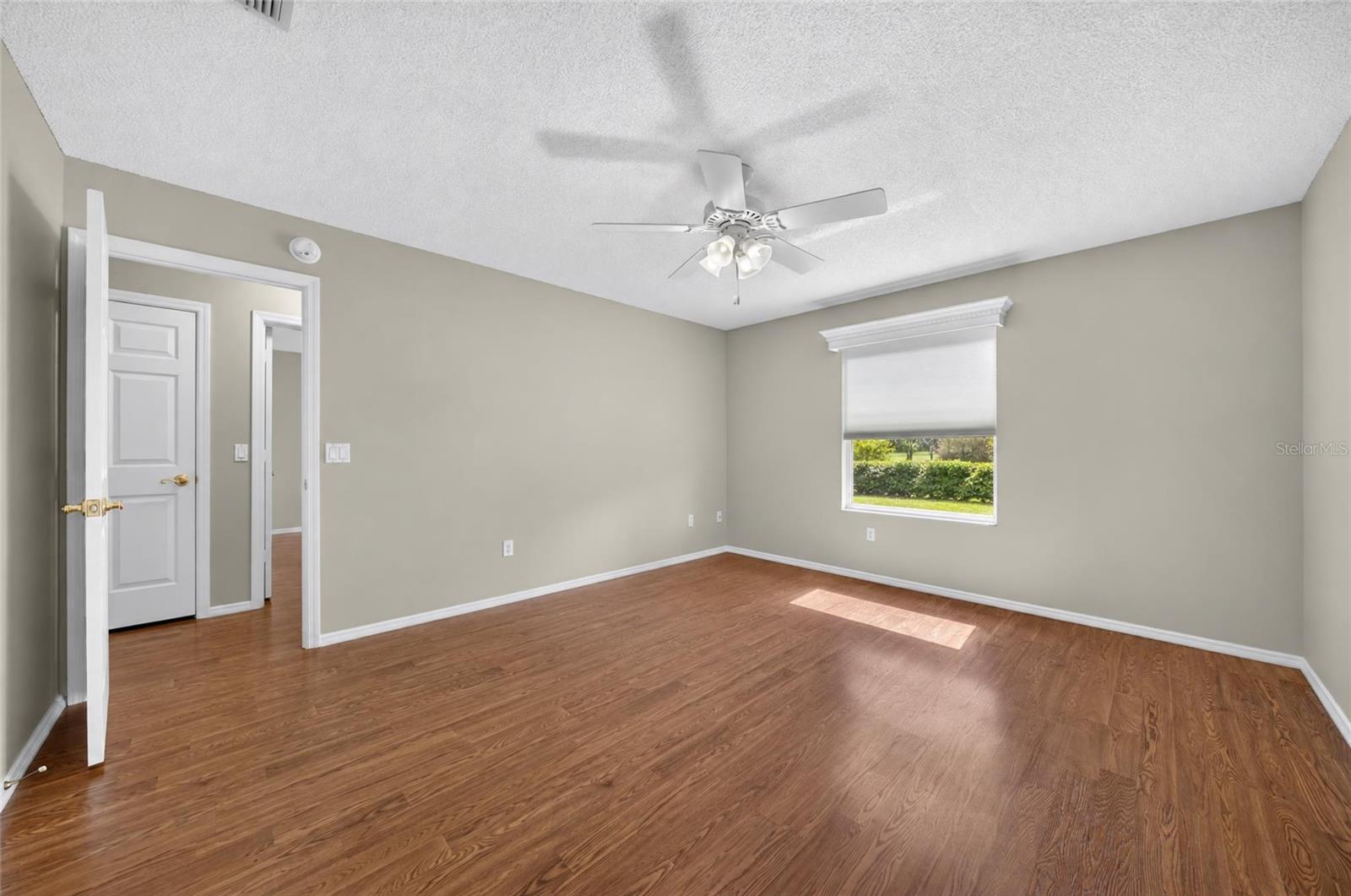 Another view of PRIMARY BEDROOM shows LINEN CLOSET in HALLWAY.
