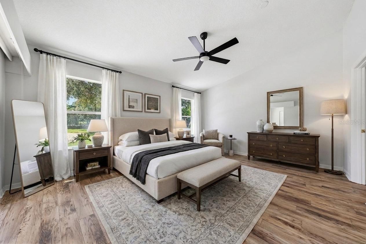 Primary Bedroom with tall ceilings - Staged