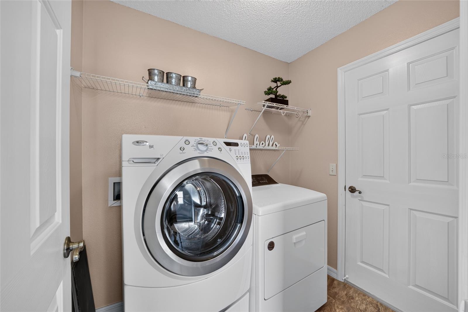 LAUNDRY ROOM OFF PRIMARY BATH TO GARAGE