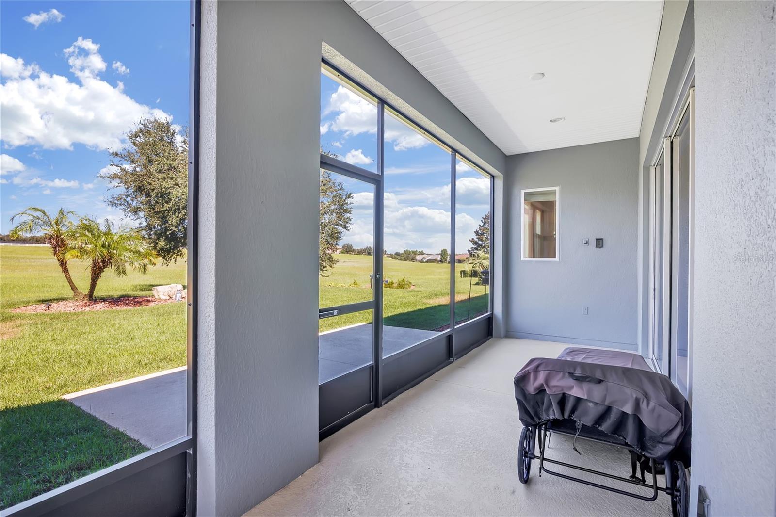 Covered and Screened Porch off Primary Bedroom
