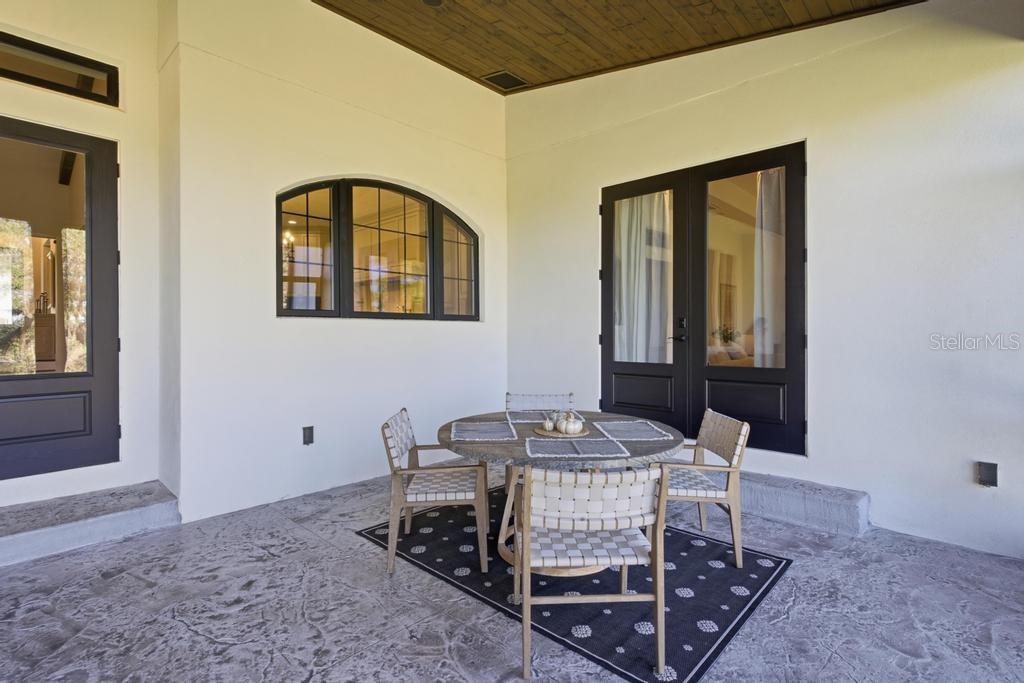 Additional seating space in your oversized porch... also a great area for future hot tub!