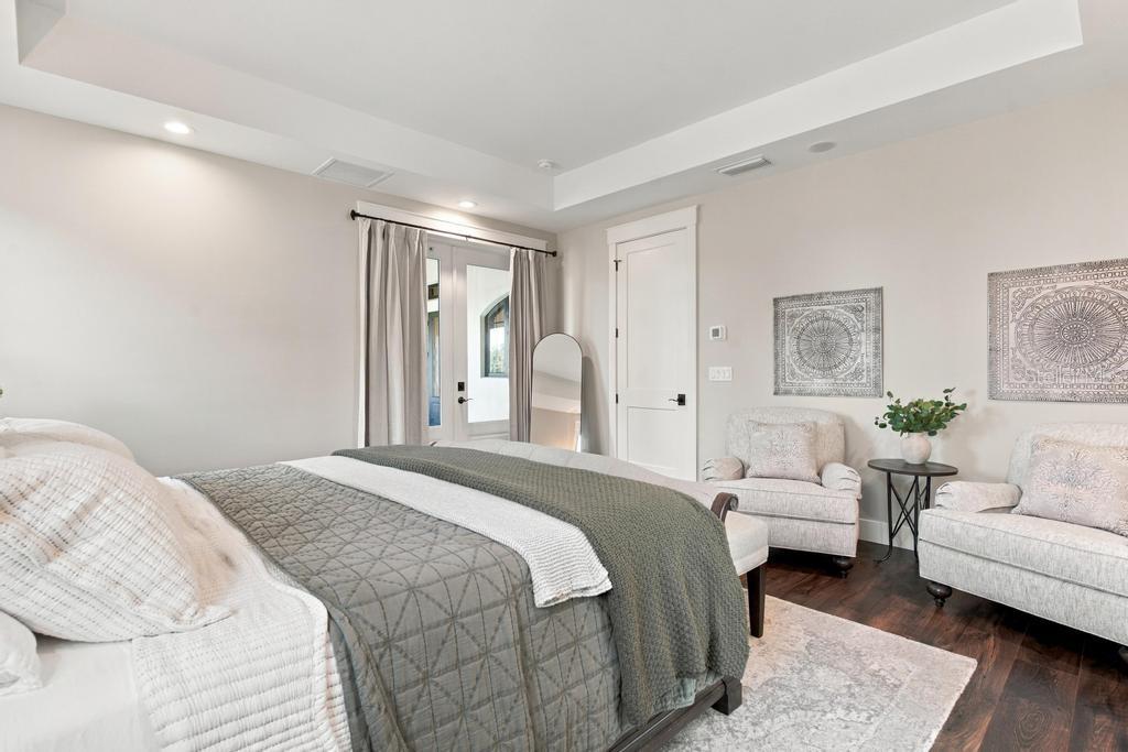 Enjoy Tray Ceilings with additional sitting area, and sconce lighting