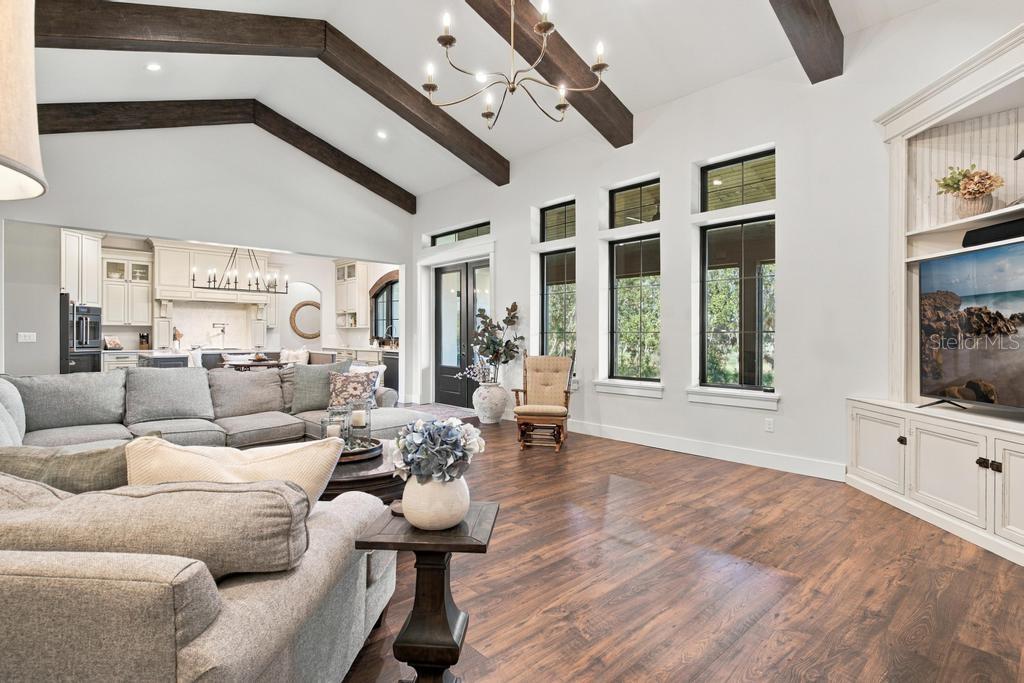 Popular design of great room opening to kitchen