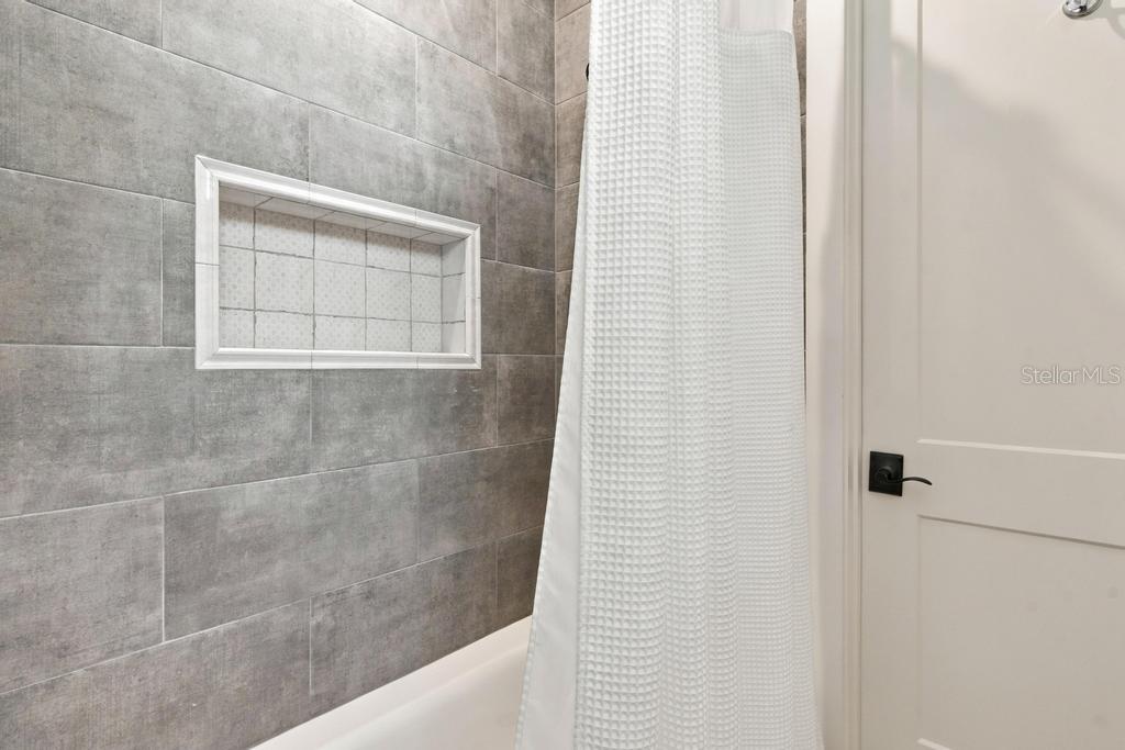 Custom tub/shower in "en-suite" two, leads to walk-in closet