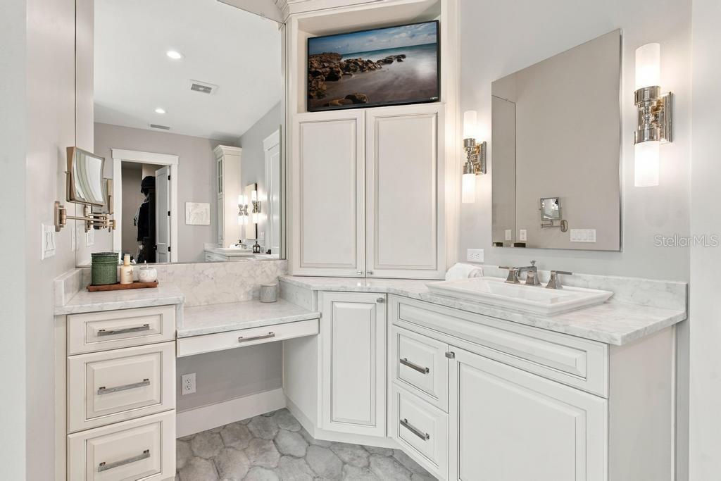 Custom vanity with quartz counter tops and make-up station