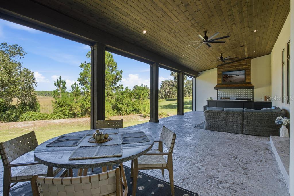 Rear porch with motorized screens