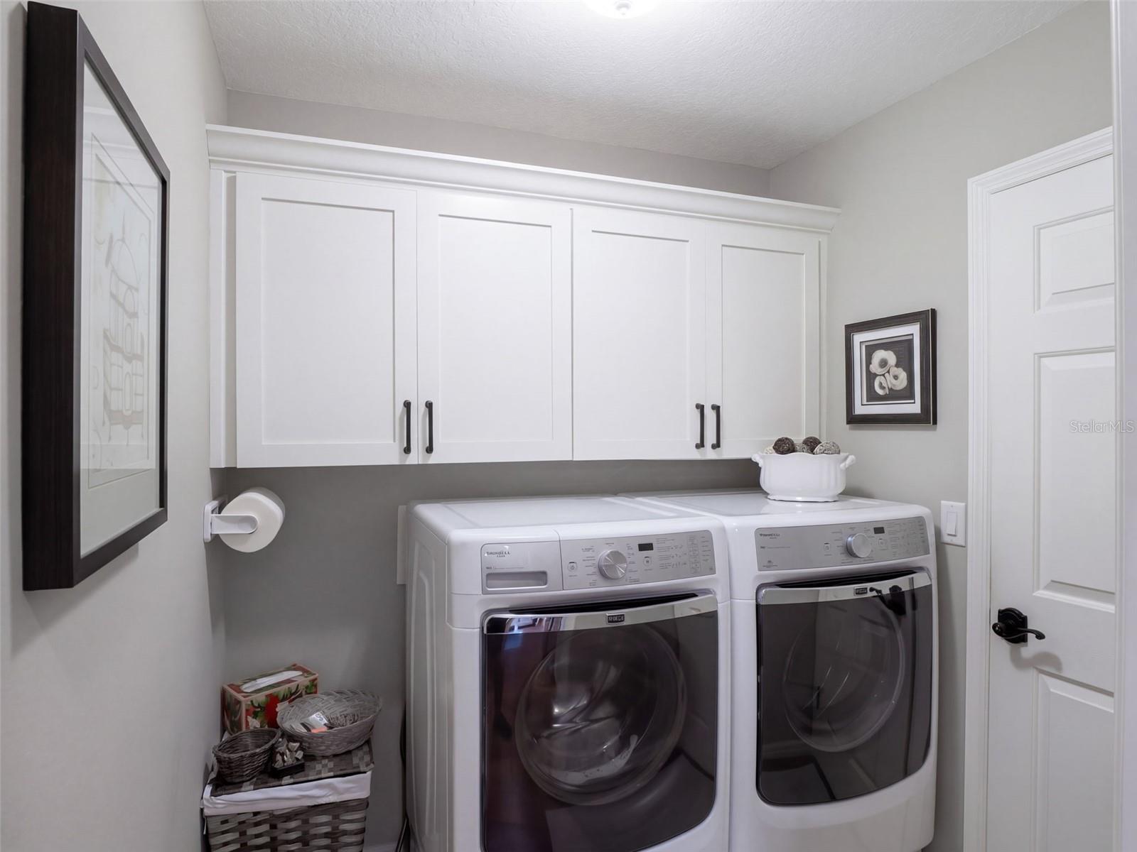 Inside laundry room with access to the garage