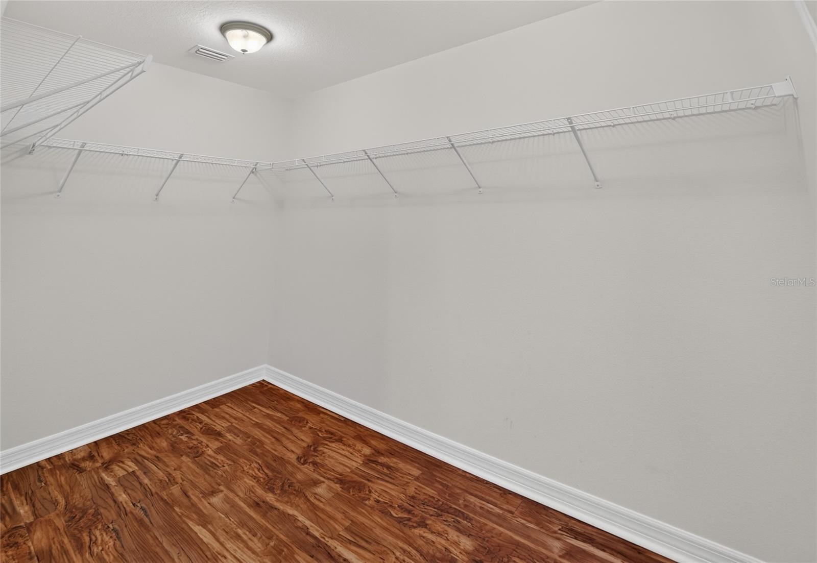 Spacious primary walk-in closet