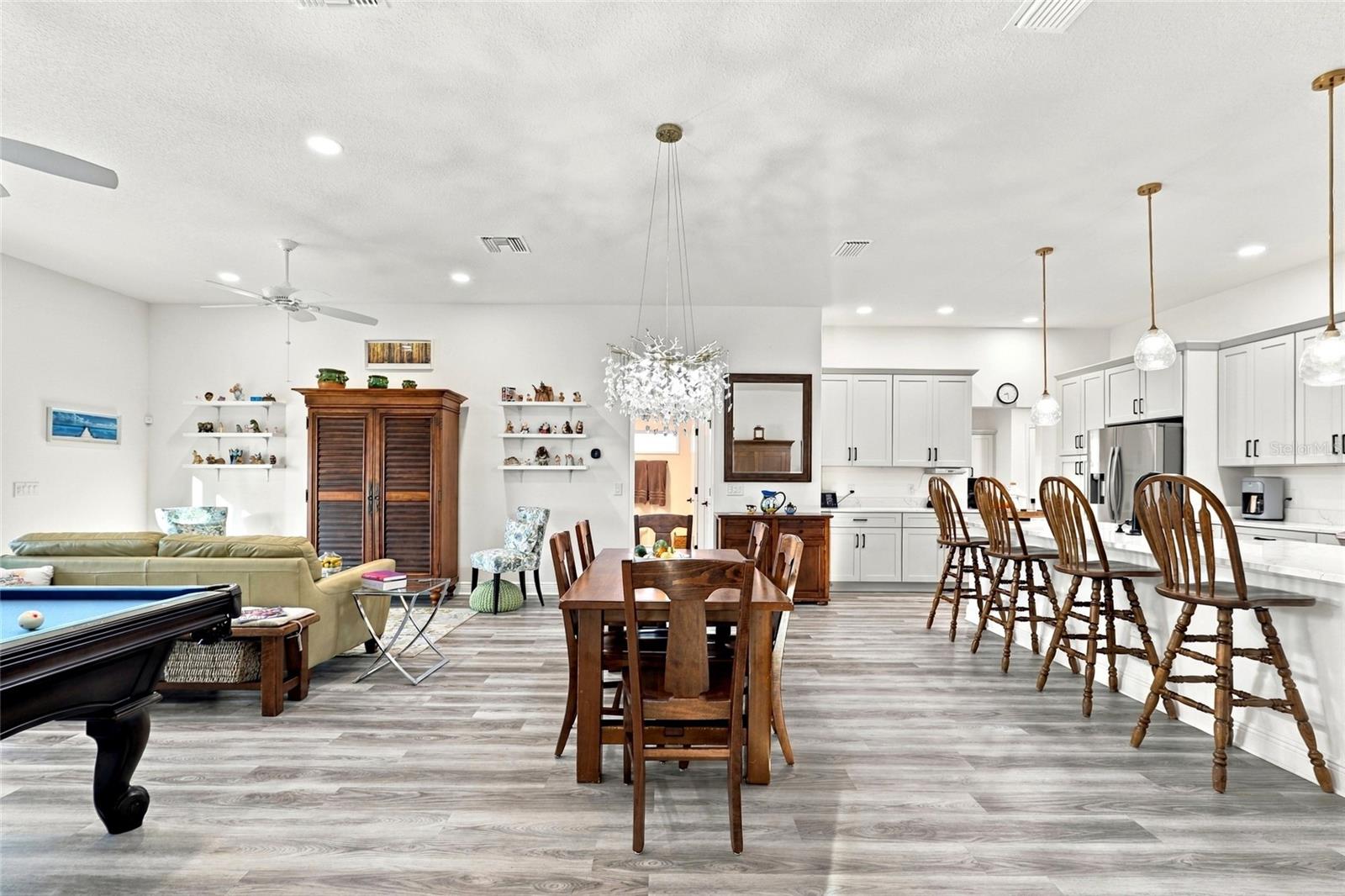 Dining Room with Living Room to the left and Kitchen to the right Dining Room with Living Room to the left and Kitchen to the right