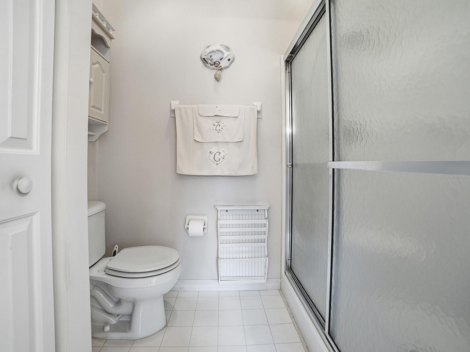 WATER CLOSET WITH SHOWER