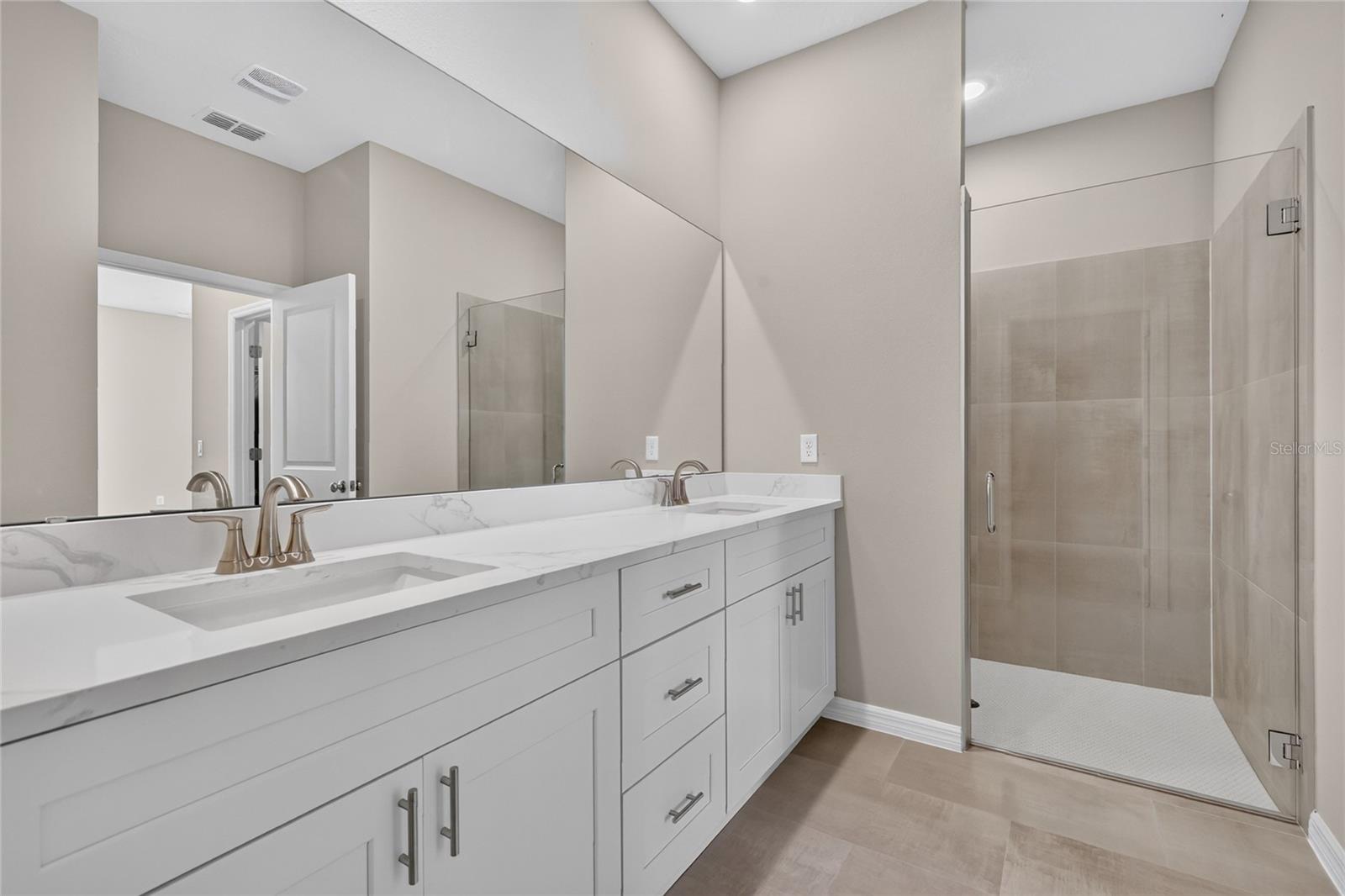 Primary bath room/dual sinks and walk in shower