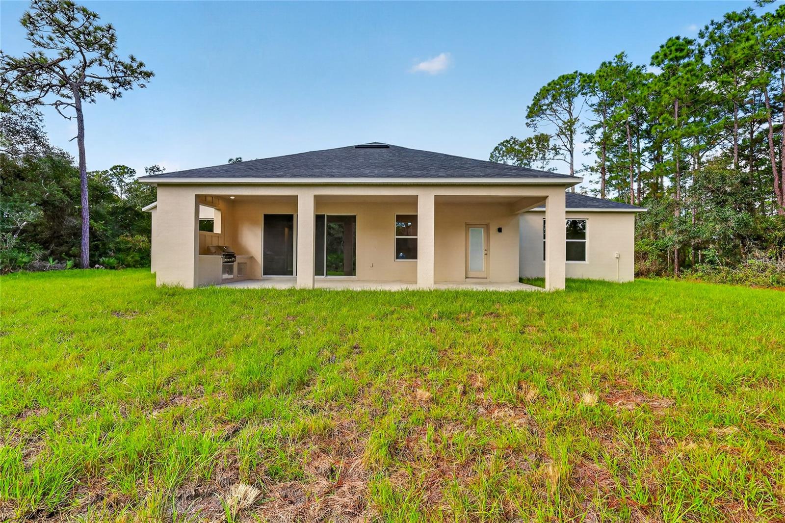 Back view of home with plenty of room for a pool