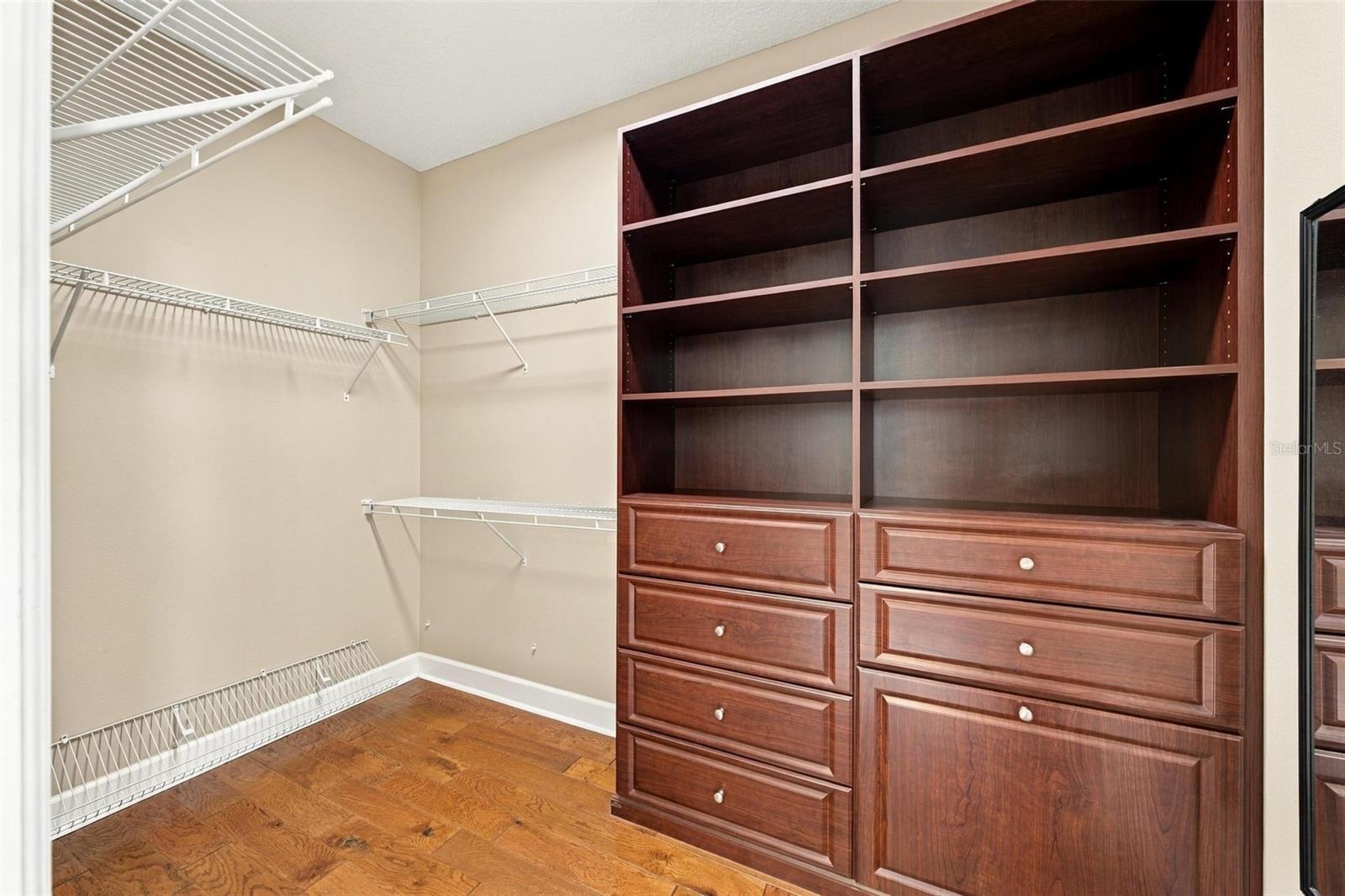 PRIMARY SUITE CUSTOM CLOSET.