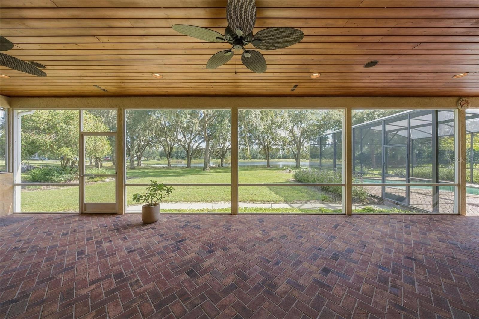HUGE LANAI WITH TONGUE & GROOVE WOOD CEILING OVERLOOKING THE PEACFUL LAND WITH LAKE VIEWS