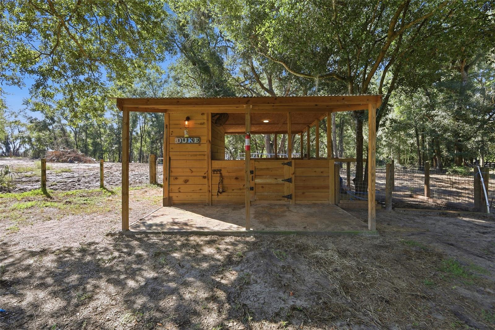 1 horse stall with storage, water & electricity. Attached to 1 of 3 large fenced in areas