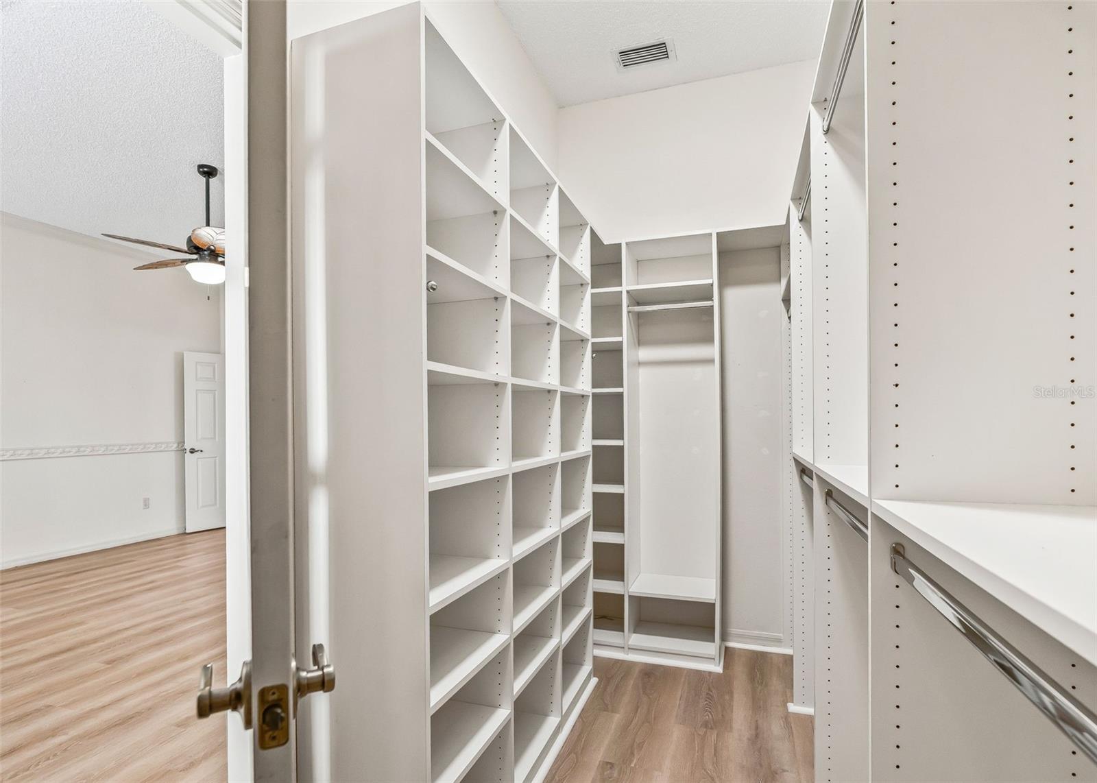 Primary Walk-In Closet w/ Organizers & Solar Tube.