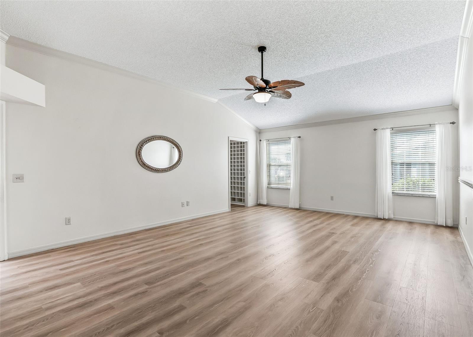 LVP Flooring. Corner Walk-In Closet