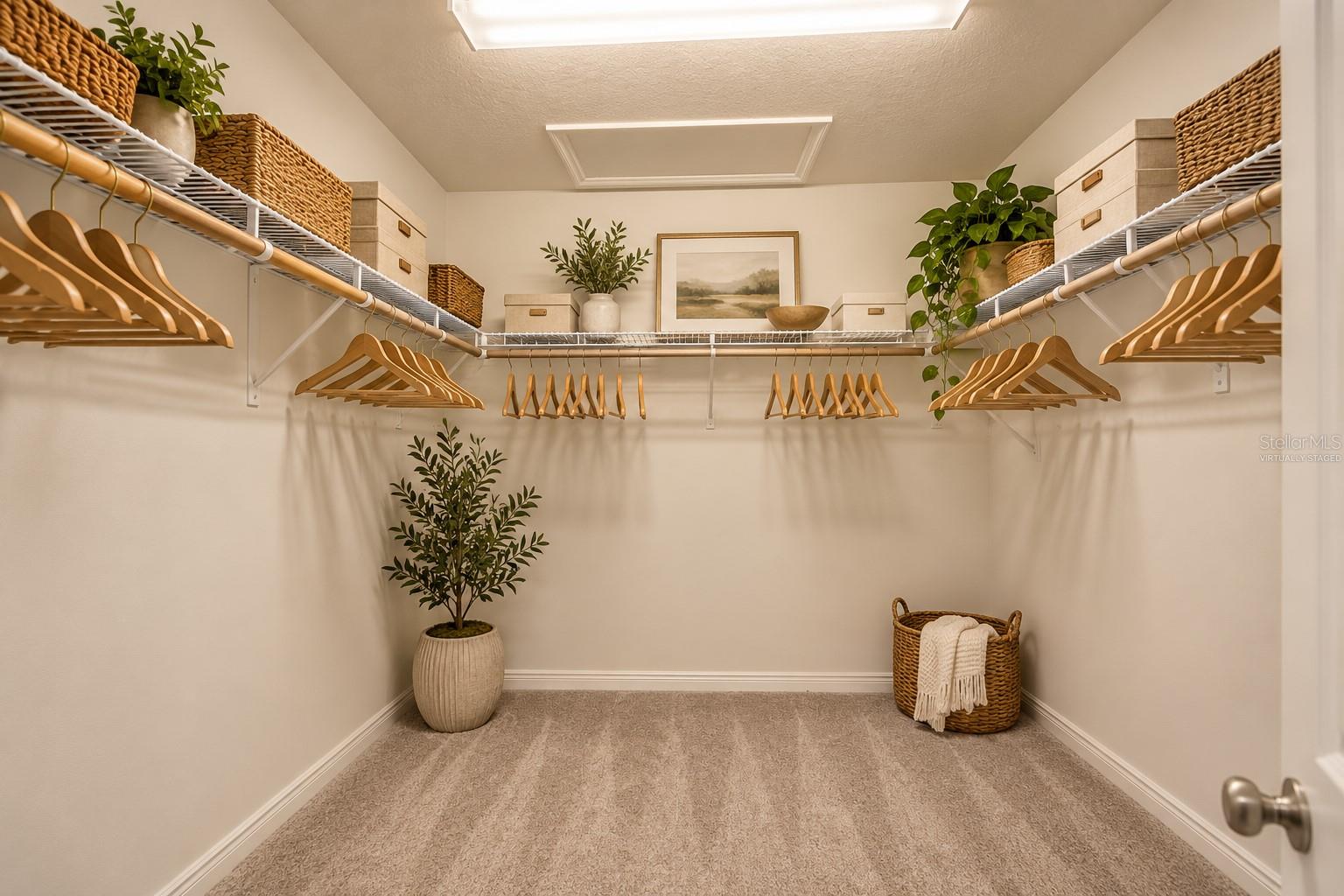 Primary Bedroom Walk-In Closet (Virtually Staged)