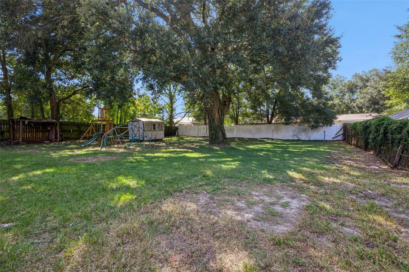 Drive gate leads to back yard - so many possibilities here!