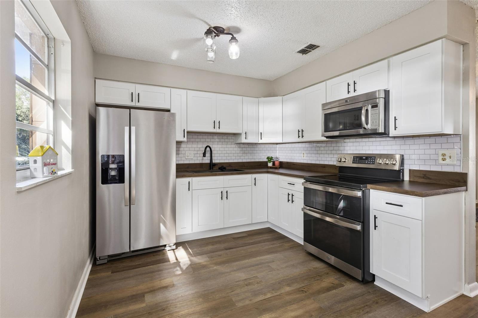 Kitchen updated with newer cabinets and appliances. Kitchen updated with newer cabinets and appliances.