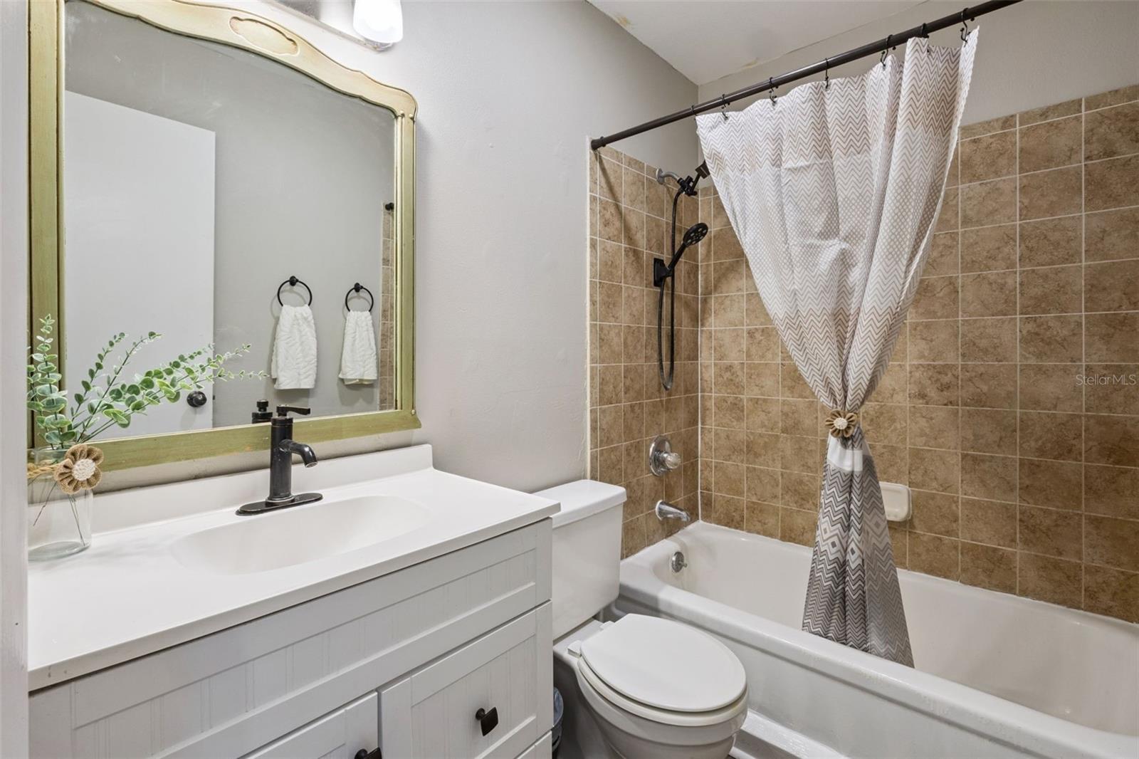 Full Bathroom with newer vanity.