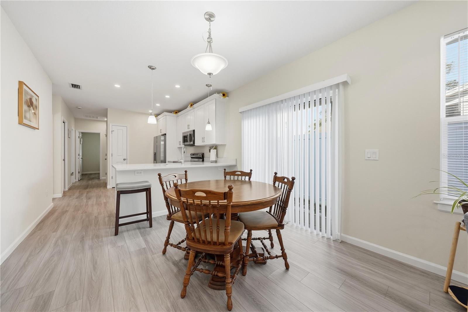 Dining area with sliding doors to the side yard