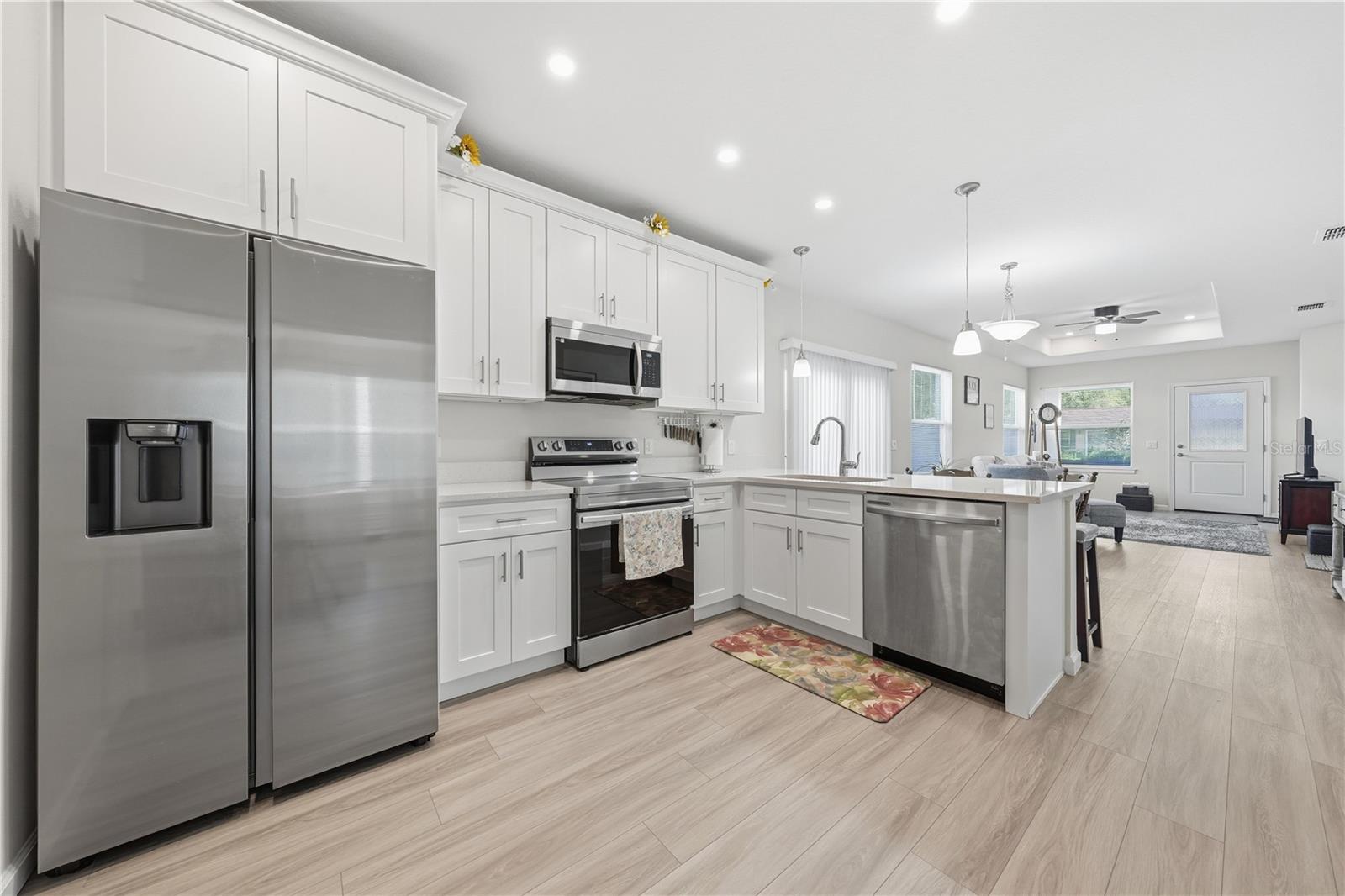 Kitchen, breakfast bar, dining area and great room