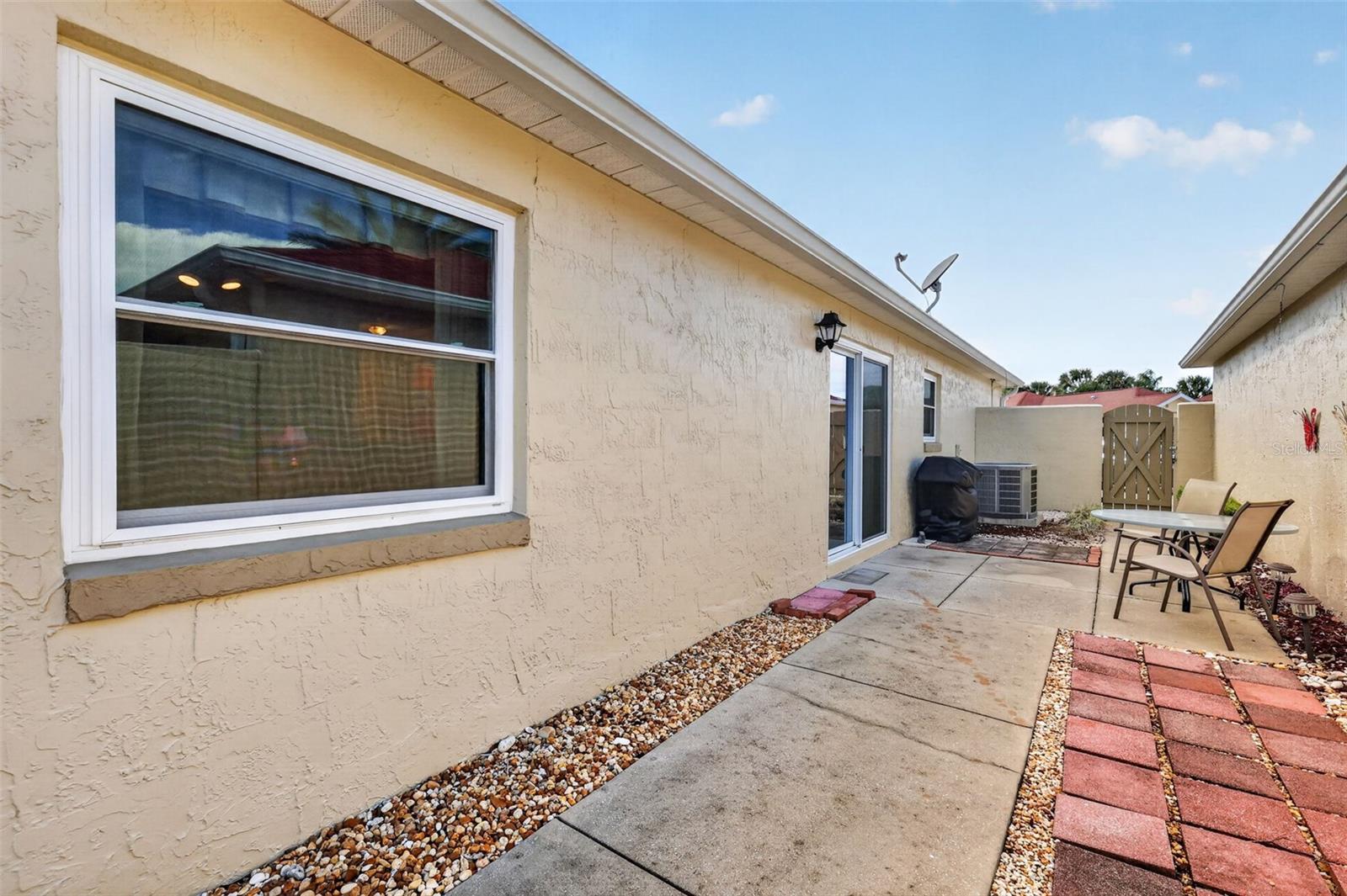 Spacious 45'x11' PRIVATE Side Courtyard and Rear Stoned Yard