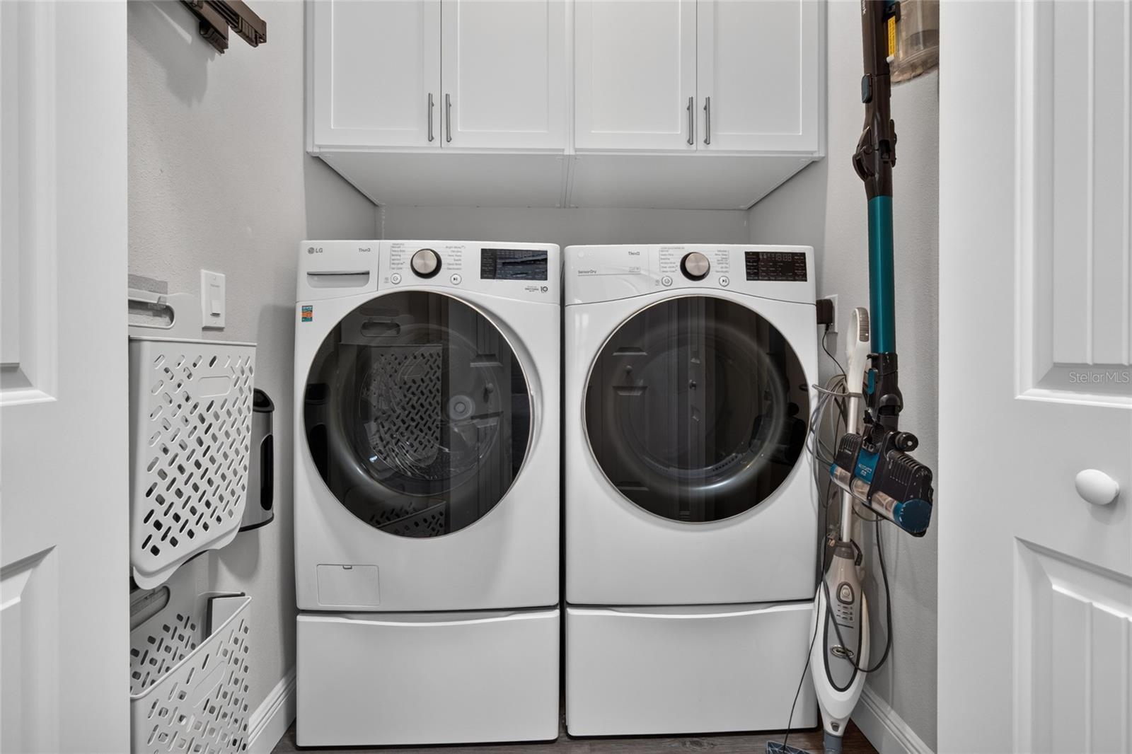 Laundry room with custom built in storage