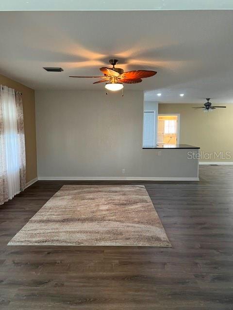 Open floor plan view of living room into kitchen area