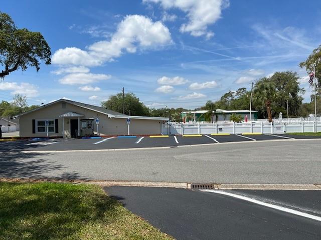 Larger View of Club house, pool area and parking.