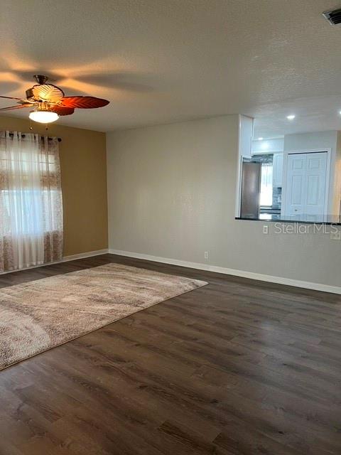 Living Room area and view into kitchen.