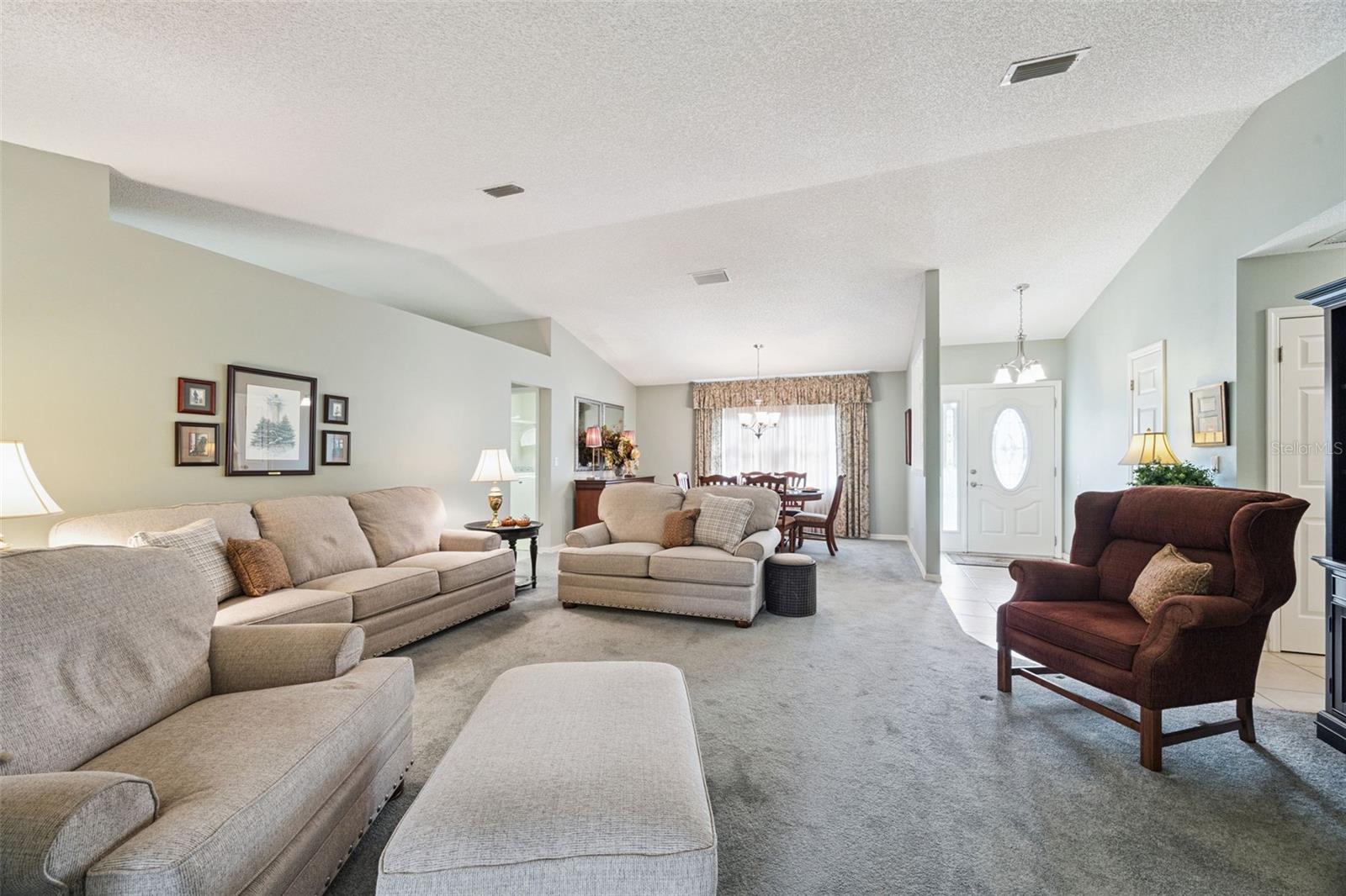 Living and dining room, foyer with coat closet