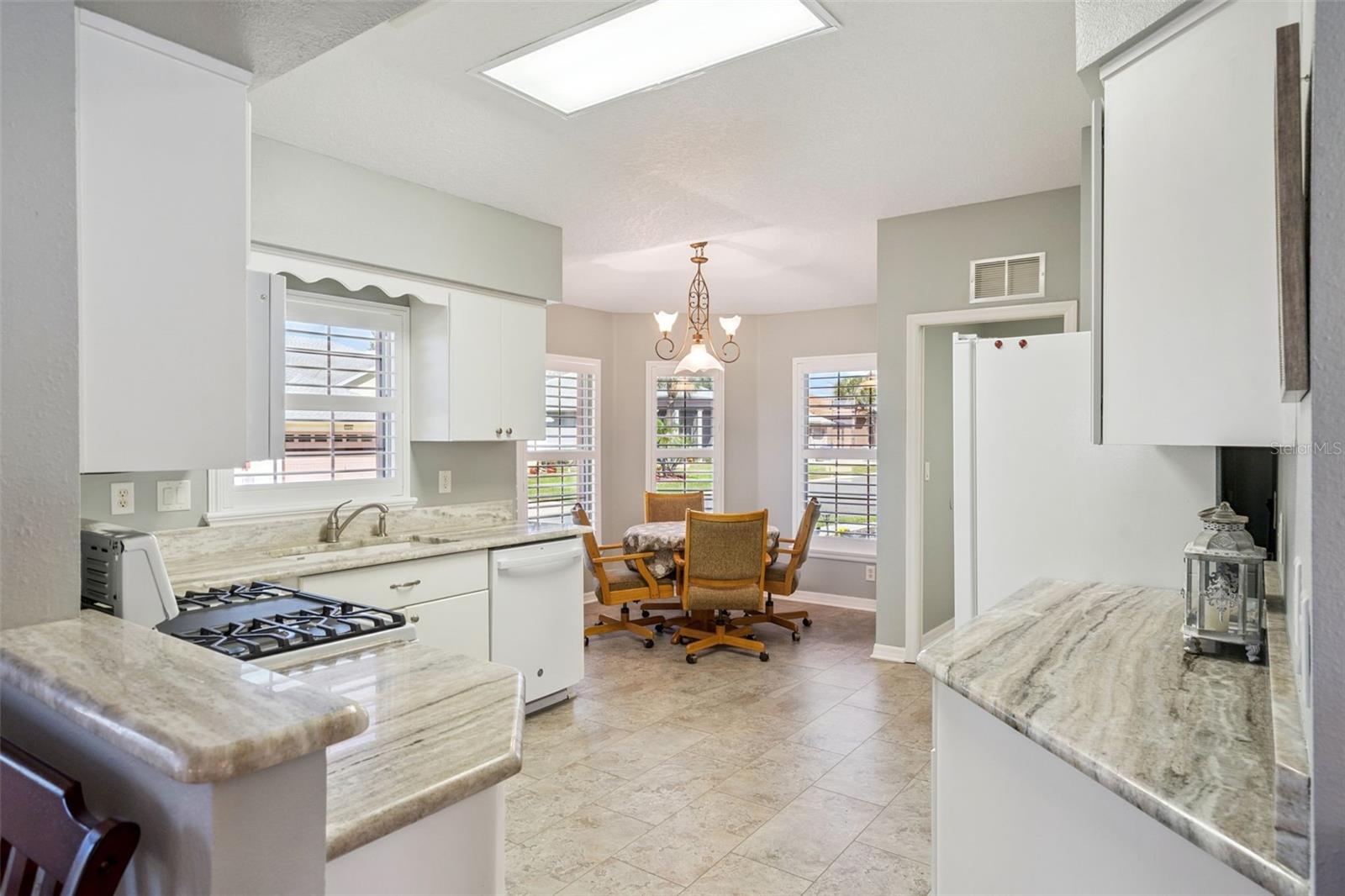 Kitchen opens to a bright eat-in nook.