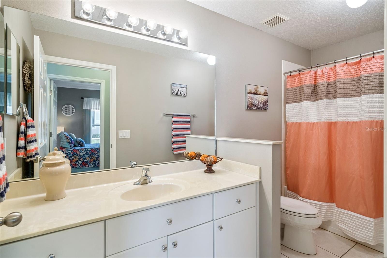 2nd full bath with spacious vanity and tub/shower.
