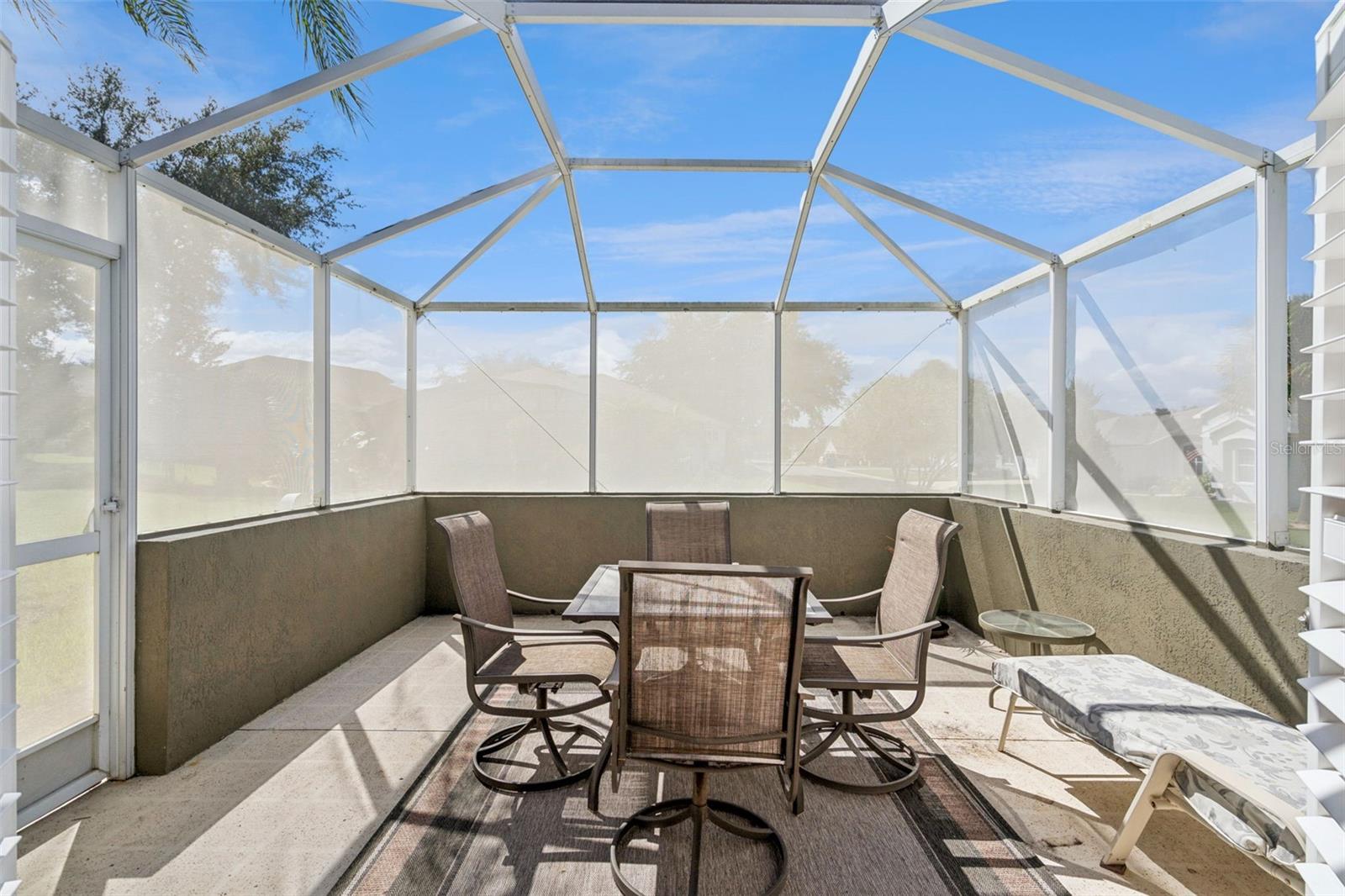 Larger screened lanai - 13.5 X 13.4 - with room to dine and relax.