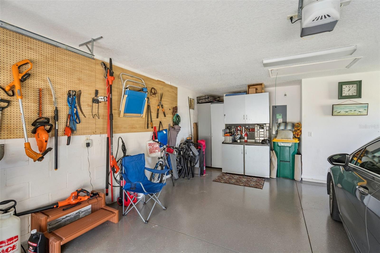 Garage with room for a workbench and storage.