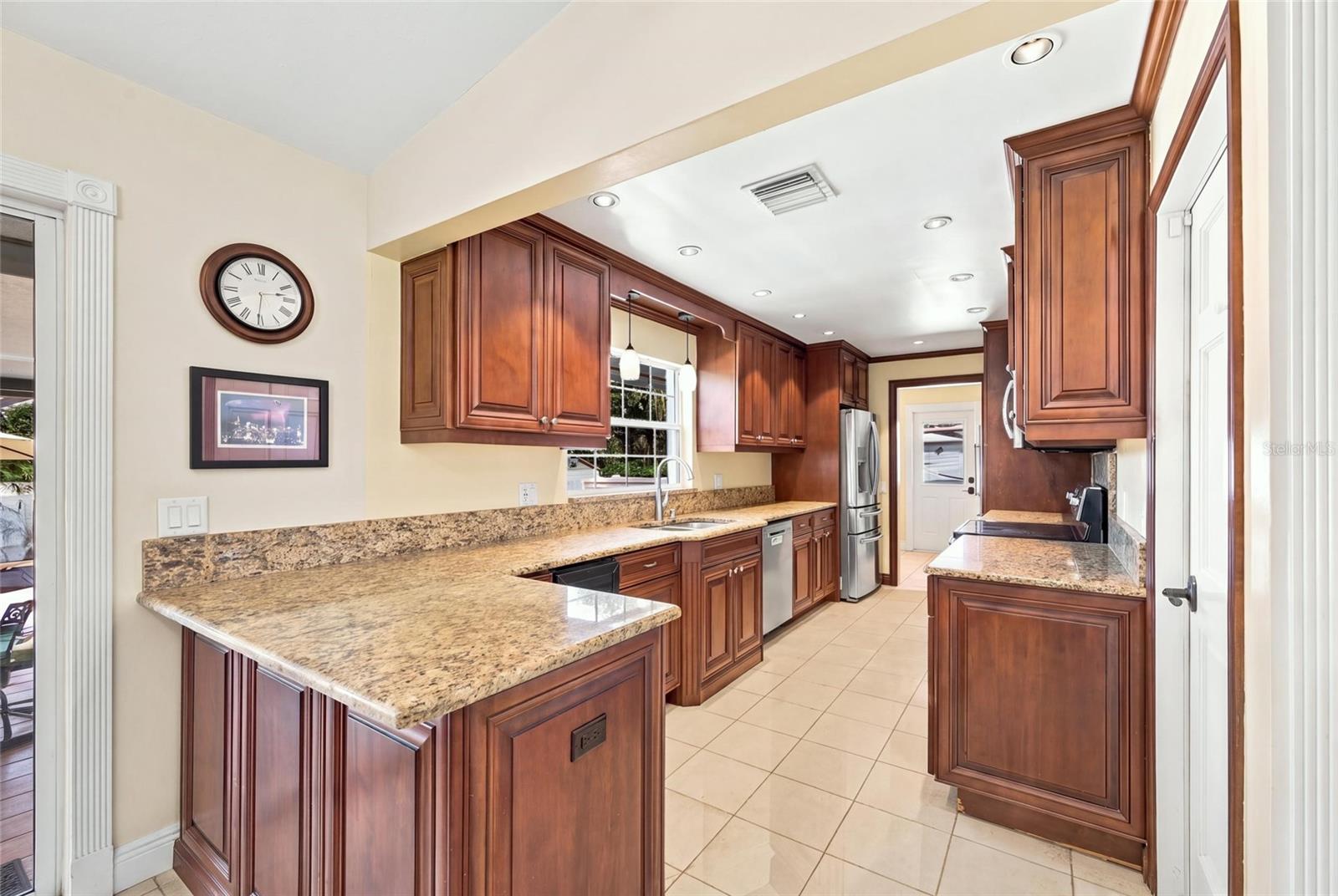 Kitchen with granite counters & wine cooler