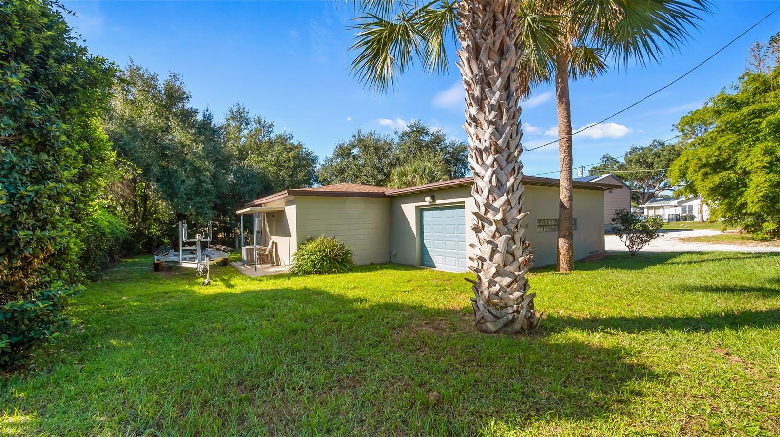 Detached garage and apartment. 2 car parking plus storage. Driveway off Lakeshore drive, little fenced in back yard. Full kitchen, laundry closet. remodeled. Pre wired for generator plug access so it can be run on a generator.