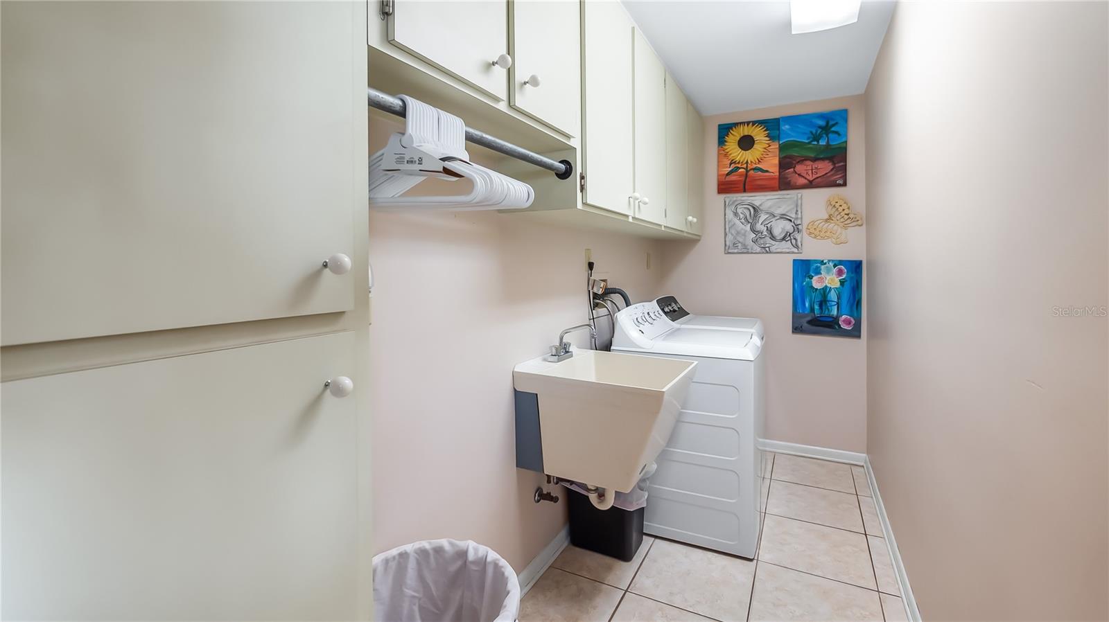 Laundry room located on north side of main home. Next to exit door to backyard/pool
